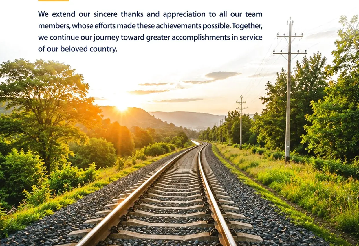 Railway track through a green landscape